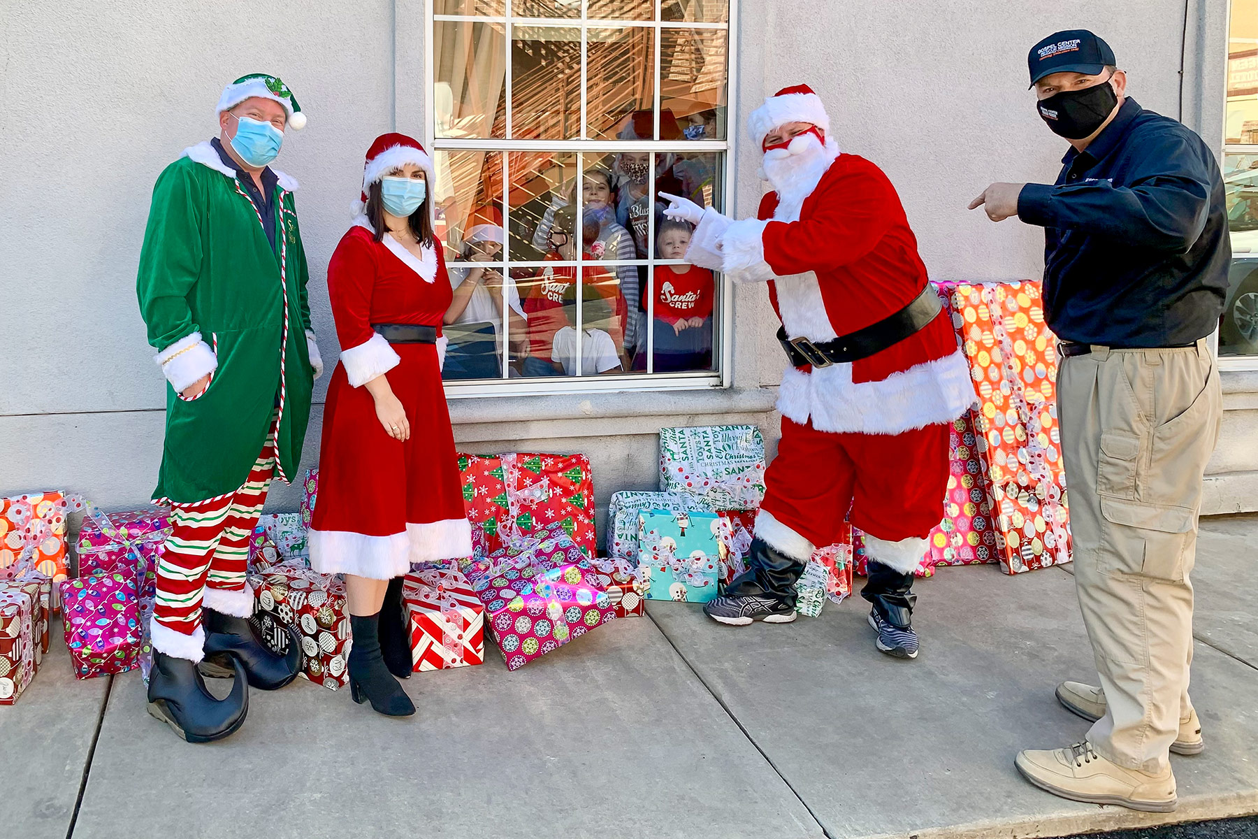 Journey crew delivering presents to GCRM kids